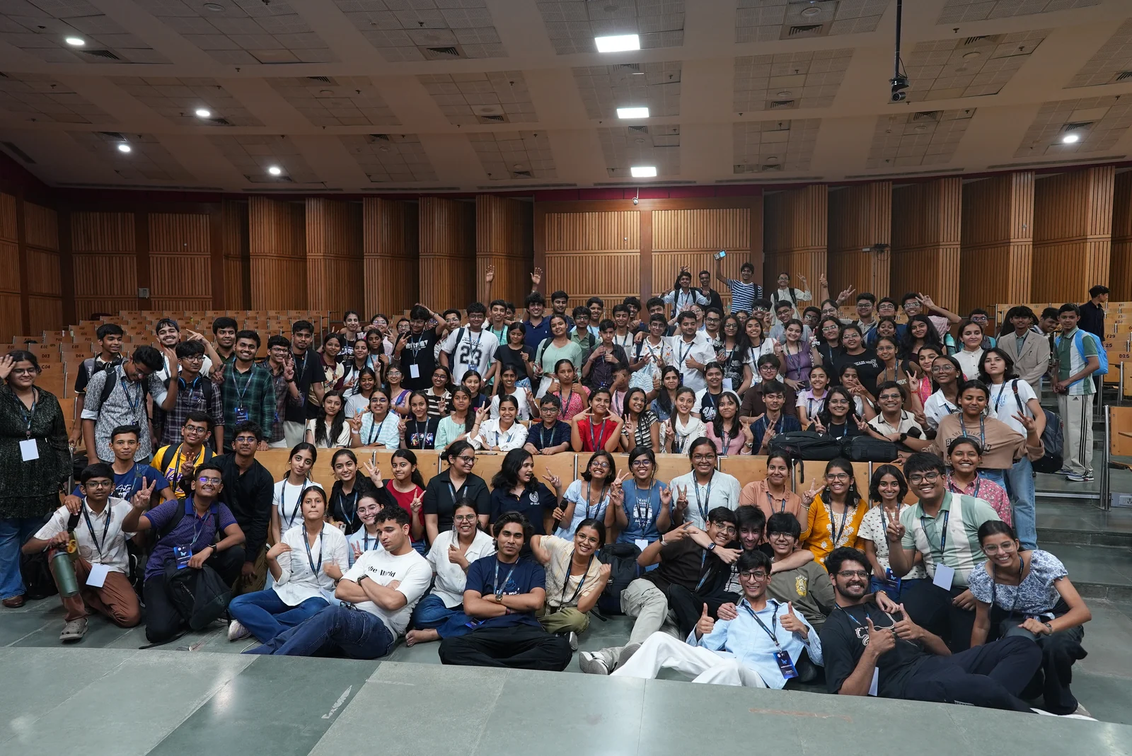 Moksh with a large group of students after a public youth event